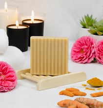 Load image into Gallery viewer, House of Beauty by Paris J turmeric and honey skin care bar with natural ingredients and textured surface.