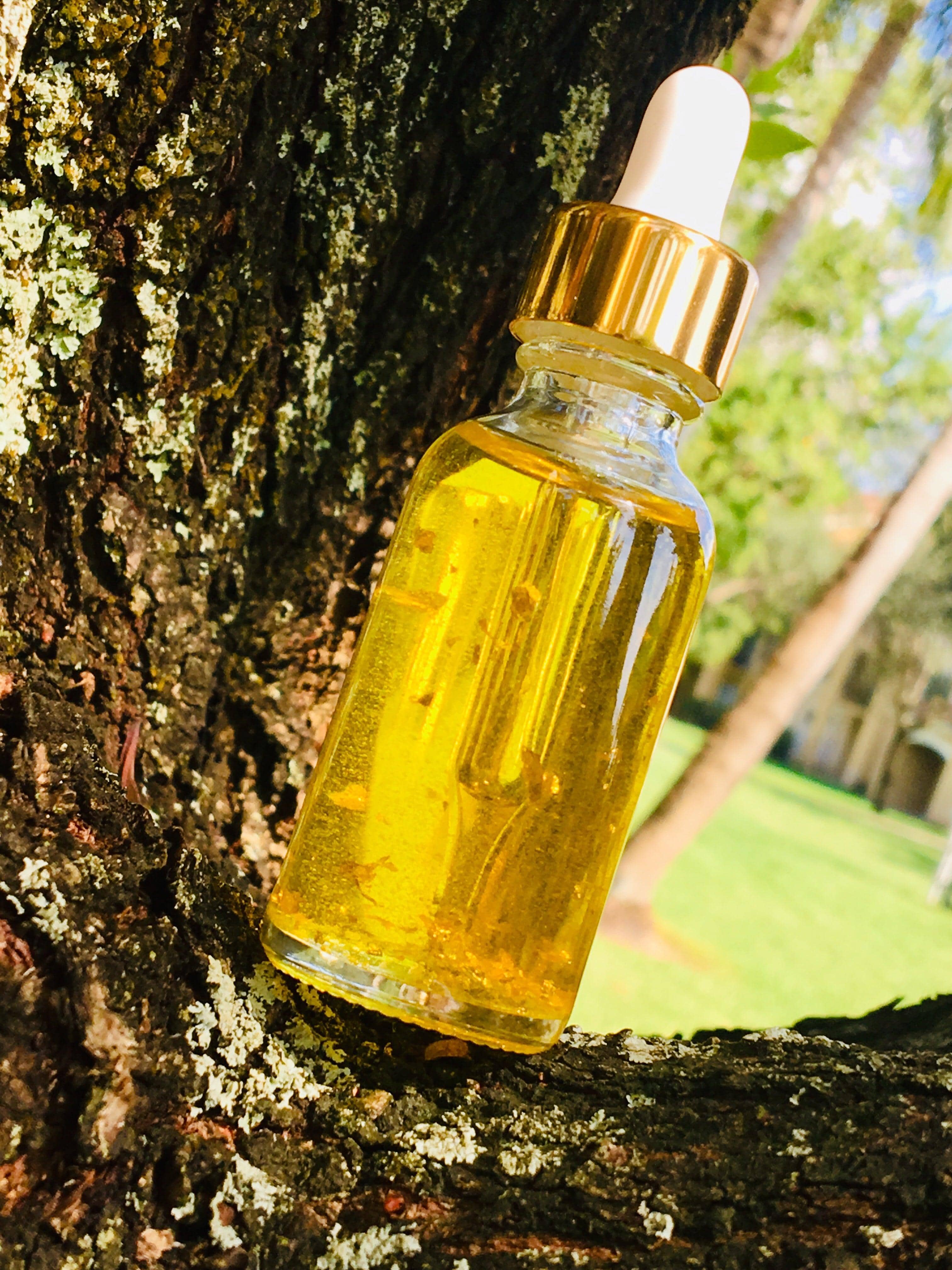 Luxury 24k gold flake serum from House Of Beauty by Paris J, featuring a sleek dropper bottle for radiant skin care.