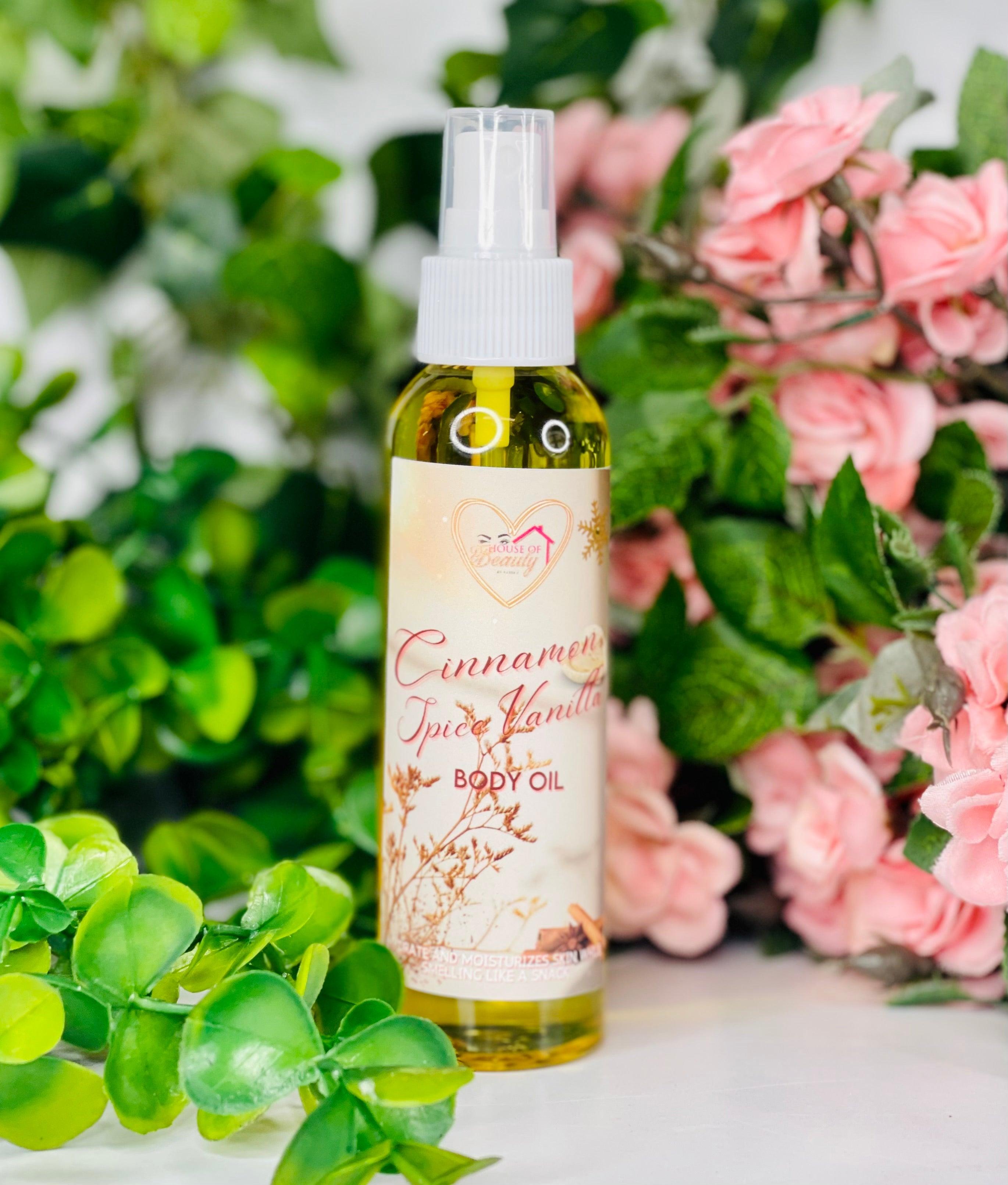 Paris House Of Beauty Cinnamon Spice Vanilla Body Oil bottle with golden cap and amber-colored oil inside.